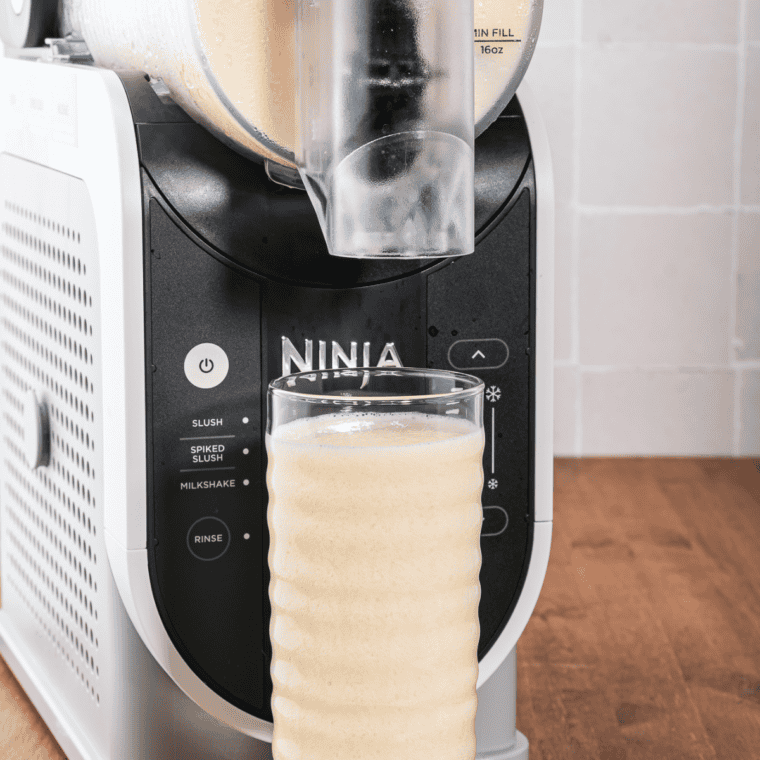Pressing the MILKSHAKE button on the Ninja Slushi control panel