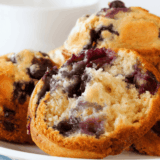 Perkins Mammoth Muffins are the reason a lot of people walk out of the restaurant carrying a bakery box. They're enormous, domed well above the rim, tender inside, and finished with a crunchy cinnamon streusel. This copycat recipe gets you all of that in a jumbo muffin tin at home, with the blueberry version as the base and six other flavors built from the same batter.