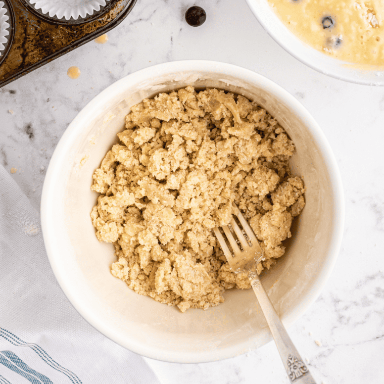 Finished streusel topping with coarse buttery crumbs in a glass bowl