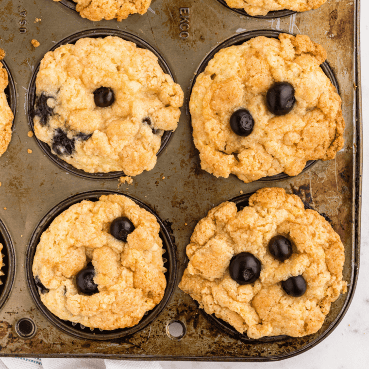 Baked Perkins Mammoth Muffins domed high above the tin rim, golden and crackled