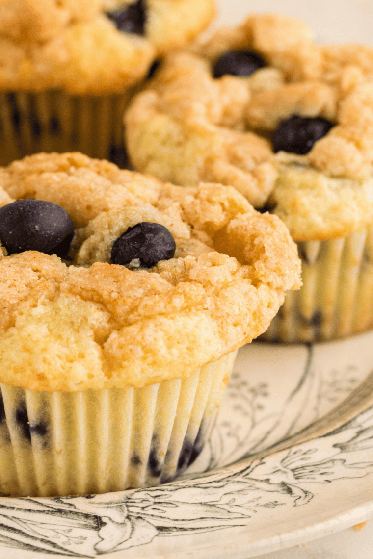Baked Perkins Mammoth Muffins domed high above the tin rim, golden and crackled