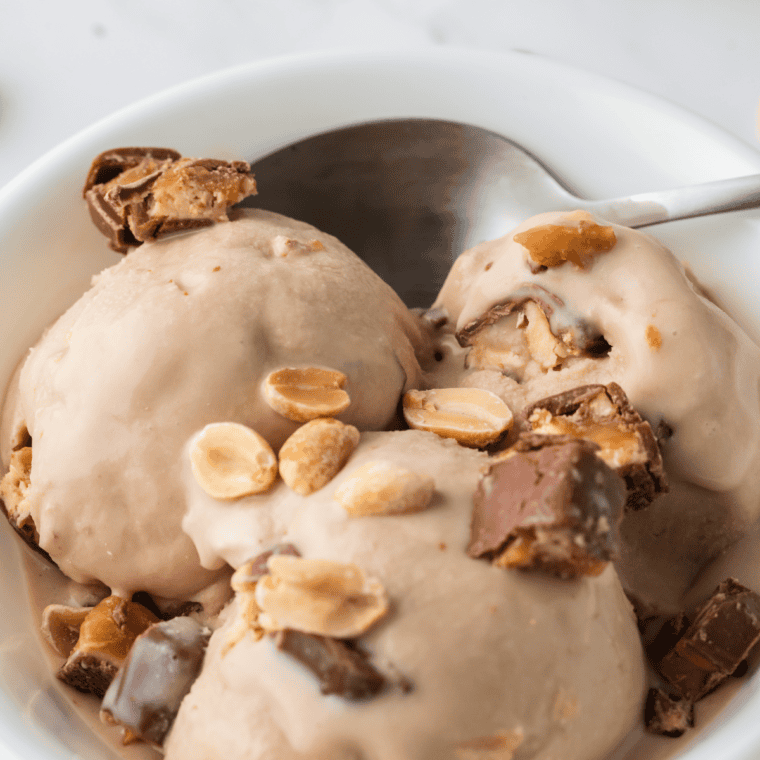 Two scoops of creamy sugar-free Ninja Creami vanilla ice cream in a white bowl