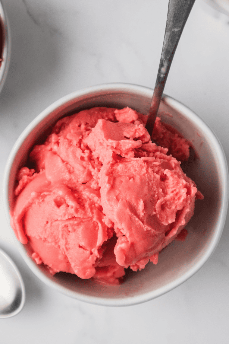 Bowl of smooth Ninja Creami vanilla ice cream with a spoon