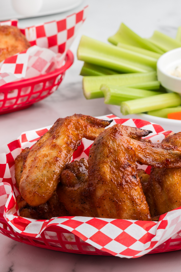 Red-checkered basket of crispy Buc-ee's BBQ wings for game day
