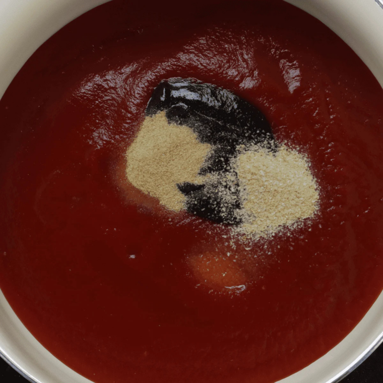 Ketchup, brown sugar, and apple cider vinegar whisked together in a small bowl for Bob Evans meatloaf glaze