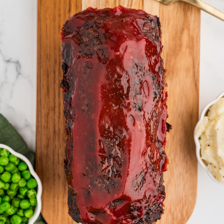 Fully baked copycat Bob Evans meatloaf with a glossy caramelized glaze in a loaf pan