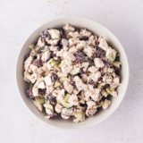 Creamy cranberry pecan chicken salad in a deli-style container, just like the grab-and-go tubs at Buc-ee's