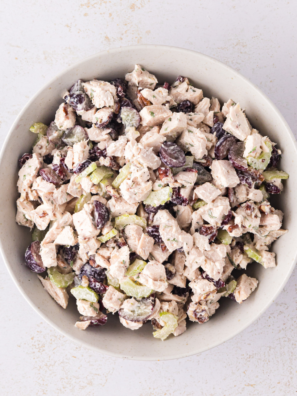 Creamy cranberry pecan chicken salad in a deli-style container, just like the grab-and-go tubs at Buc-ee's
