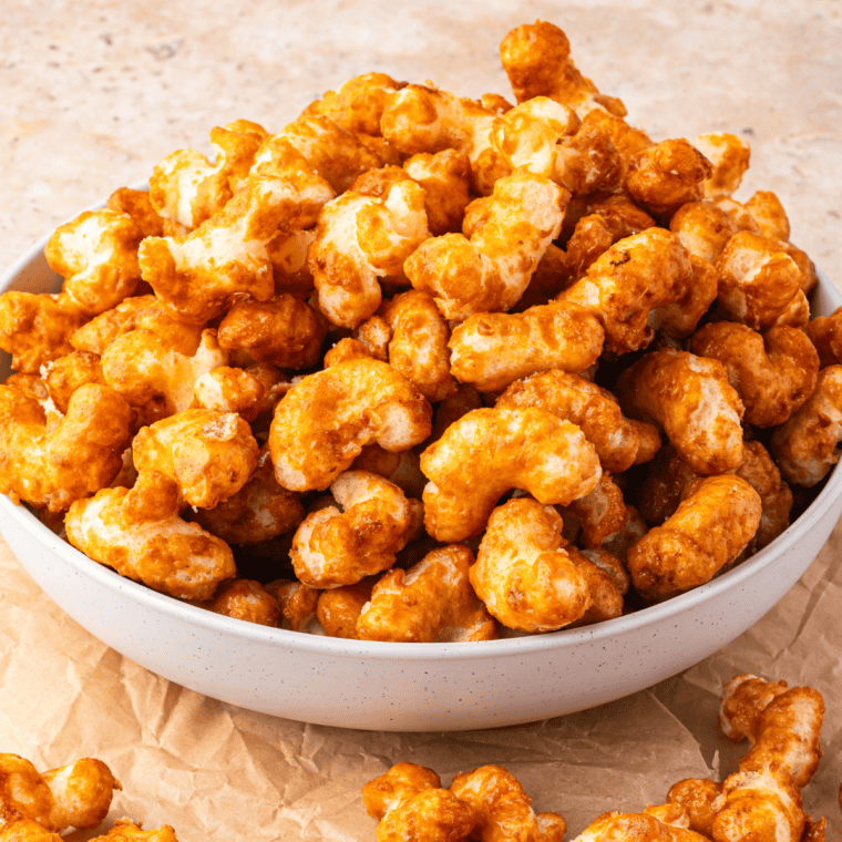 Baked copycat Beaver Nuggets cooling on parchment paper