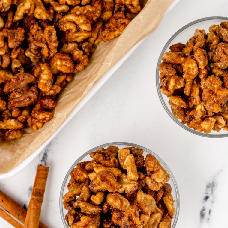 Bowls of cinnamon sugar candied walnuts ready for snacking or holiday gifting.