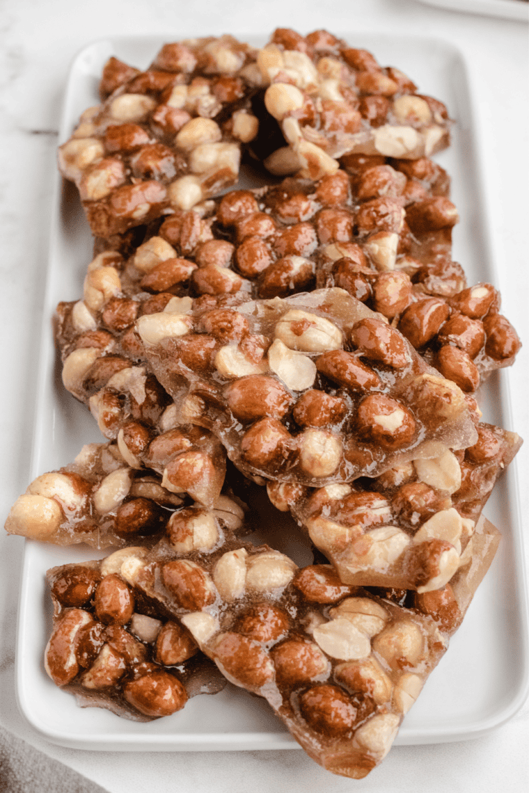 Stack of creamy Texas pecan pralines with whole pecans on to