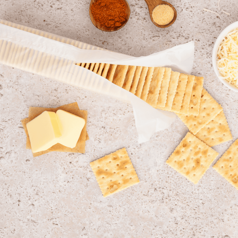 Ingredients for ranch saltine crackers: saltines, canola oil, ranch packet, dried dill, garlic powder, onion powder, and black pepper