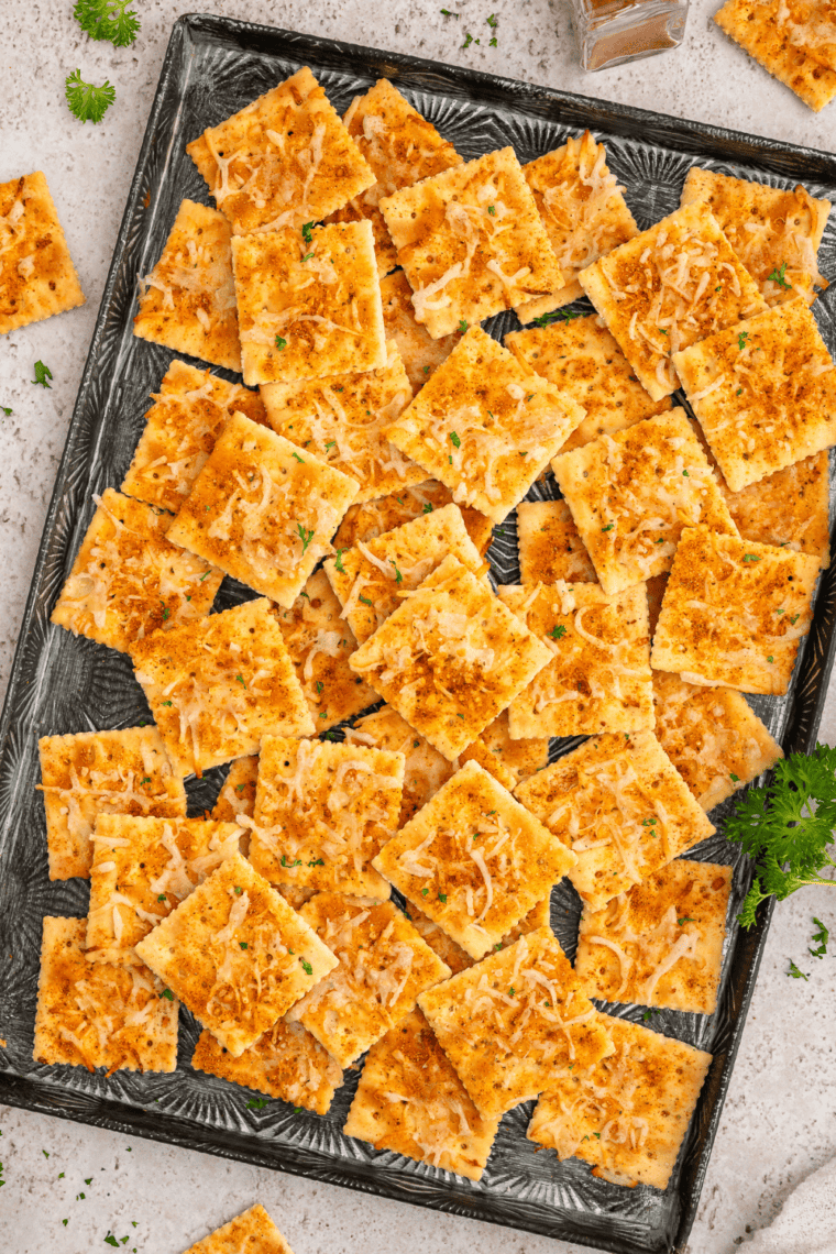 Close-up of a ranch saltine cracker showing dill and seasoning on the surface