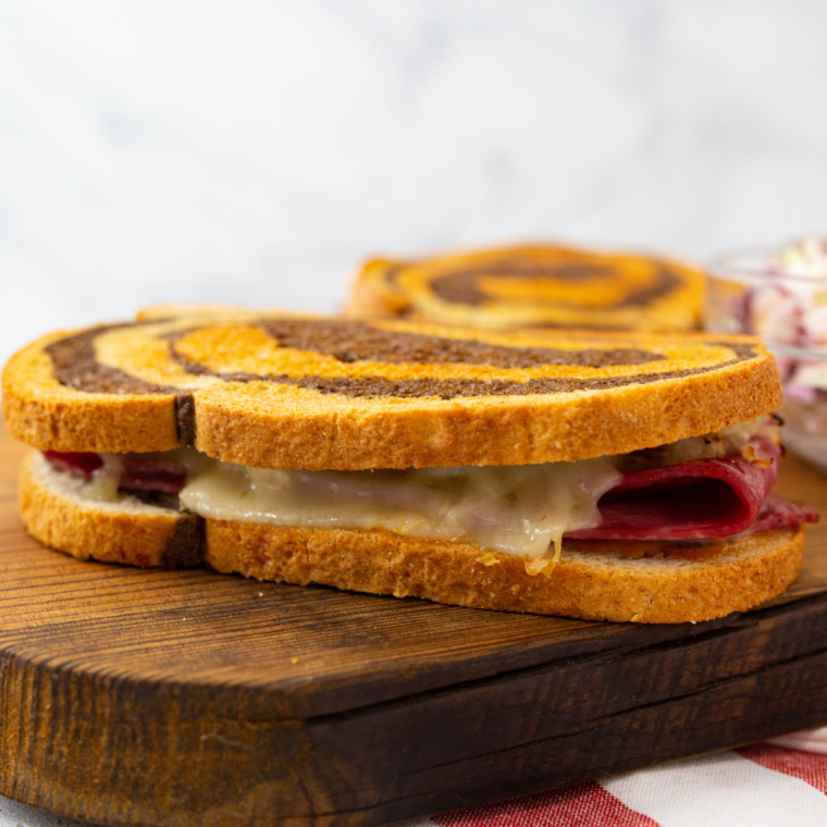 Culver's Reuben melt served with coleslaw and onion rings