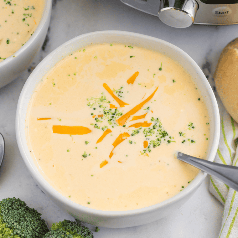 Loaded broccoli cheese soup topped with crumbled bacon and diced potatoes