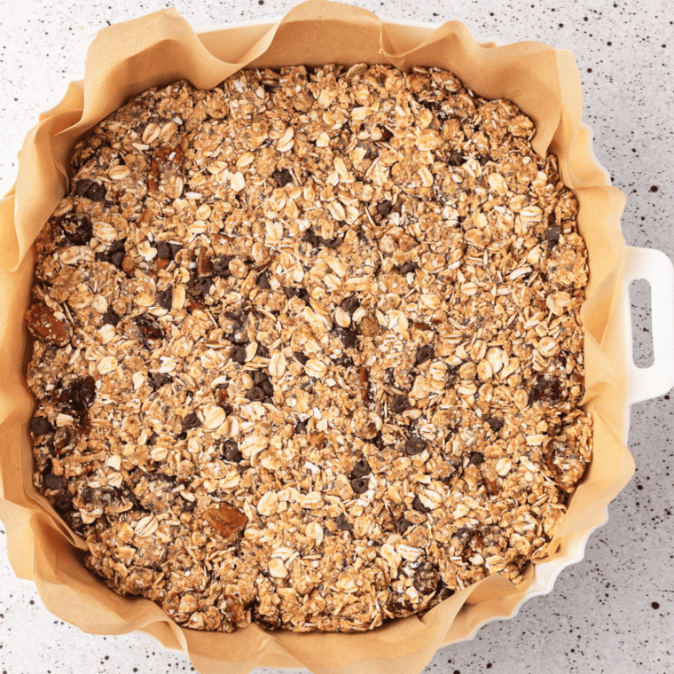 Golden brown granola in the air fryer basket after cooking