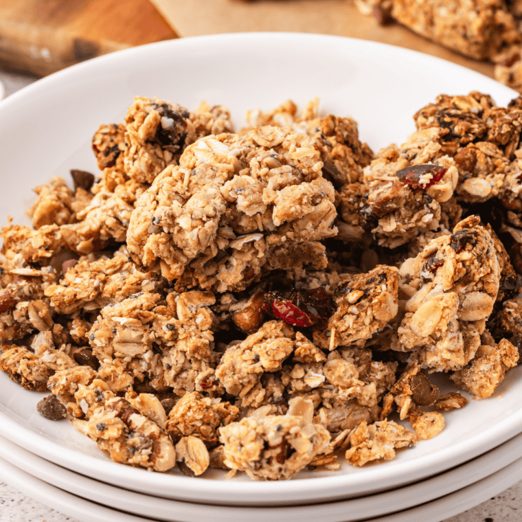 Close-up of crunchy peanut butter protein granola clusters with peanuts and almonds