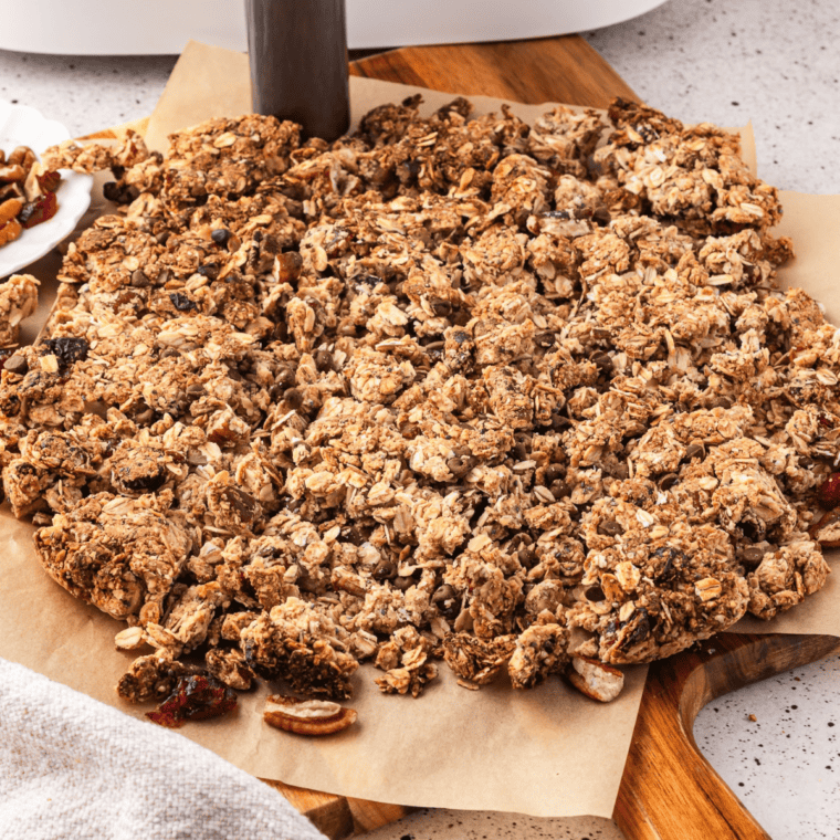 Copycat Nature Valley Protein Granola clusters in a white bowl with a spoon