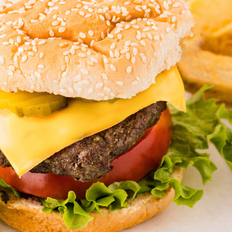 Close-up of a smashed burger patty with crispy lacy edges and a golden seared crust