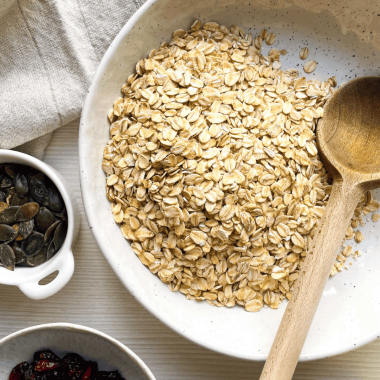 Rolled oats, sliced almonds, brown sugar, and cinnamon combined in a large mixing bowl