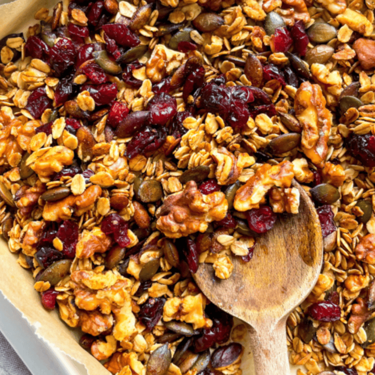 Baked granola broken into large clusters and tossed with raisins and dried cranberries