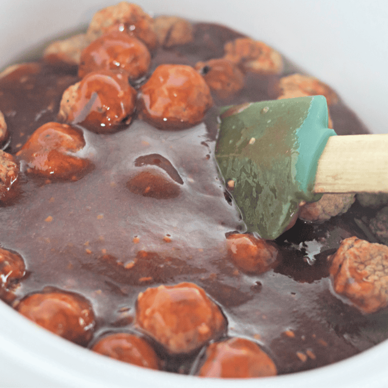 Browned frozen meatballs in a Ninja Foodi Cook and Crisp basket