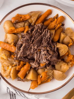 Make Denny's Slow Cooked Pot Roast Bowl at home. Fork-tender chuck roast over red-skinned mashed potatoes with roasted vegetables and rich brown gravy.