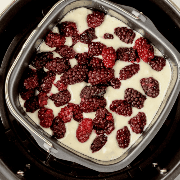 Biscuit dough dropped in rough mounds over hot blackberry filling, brushed with cream and sprinkled with turbinado sugar
