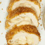 Ina Garten chicken cordon bleu sliced to show melted Gruyère and ham inside a golden panko crust