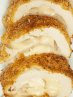Ina Garten chicken cordon bleu sliced to show melted Gruyère and ham inside a golden panko crust