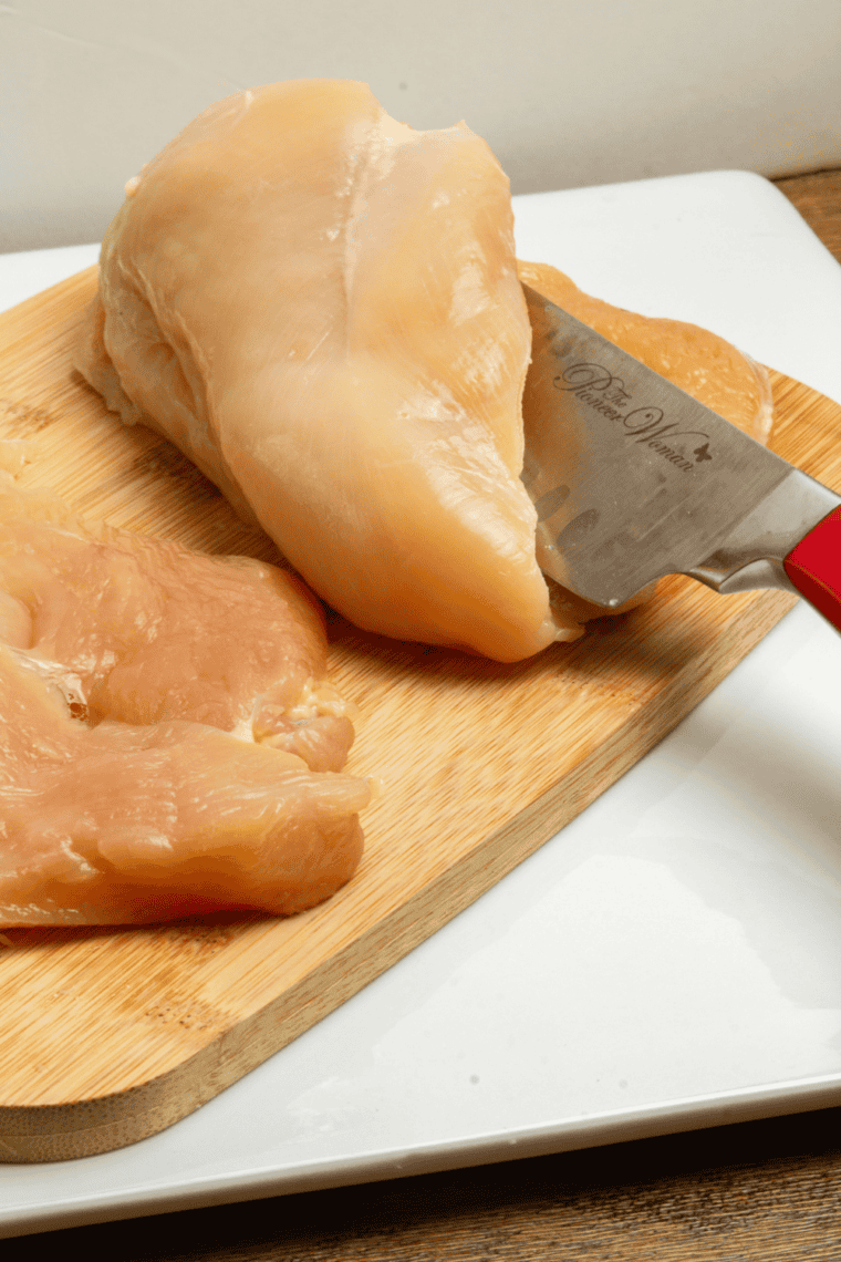 Chicken breast pounded thin between plastic wrap with a meat mallet