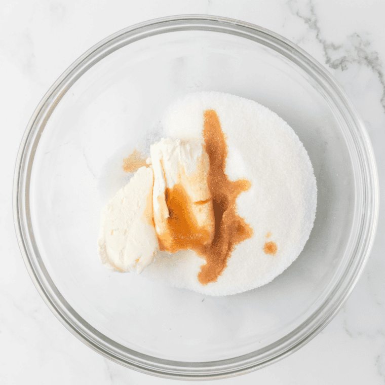 Whisking cream cheese, sugar, cocoa powder, and peanut butter into a smooth chocolate peanut butter ice cream base for Ninja Creami Reese's ice cream