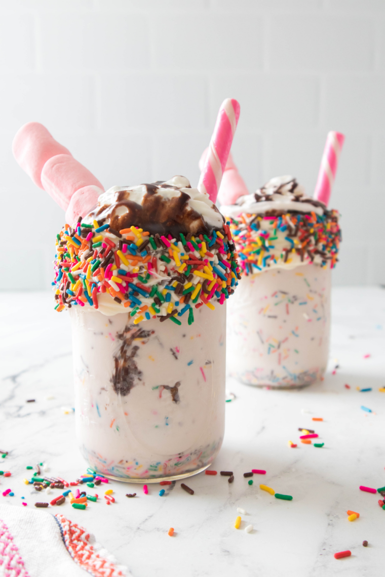 Steak n Shake birthday cake shake recipe pin with whipped cream, sprinkles, and text overlay