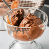 Bowl of Ninja Creami World Class Chocolate ice cream with milk chocolate scoops and a white chocolate mousse swirl