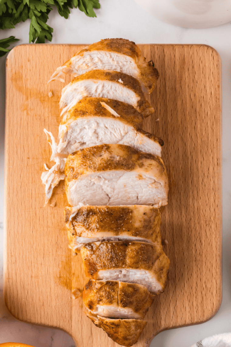 Air fried chicken breast sliced to show juicy center, cooked in the Ninja Crispi