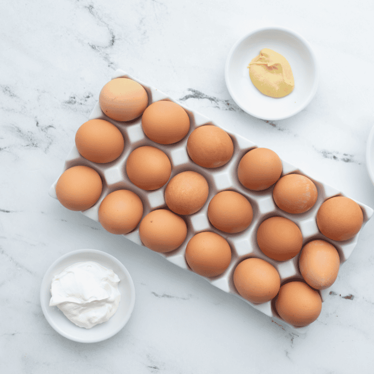 Eggs, mayonnaise, sweet pickle relish, yellow mustard, salt, pepper, and paprika for Southern deviled eggs