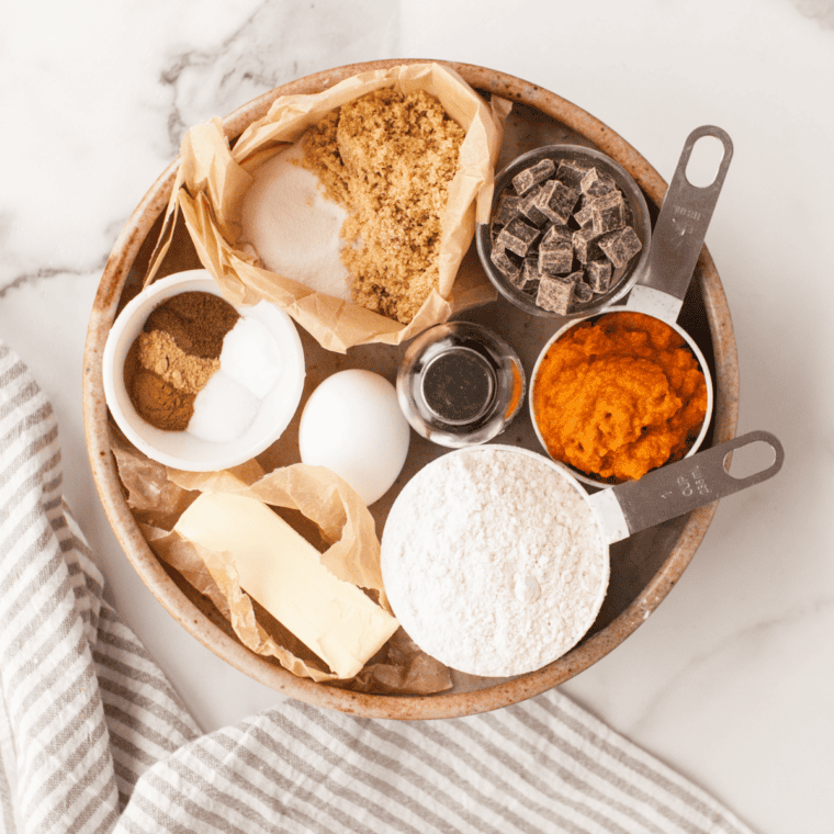 ngredients for pumpkin snickerdoodle cookies including pumpkin puree, butter, sugars, flour, cream of tartar, pumpkin pie spice and cinnamon