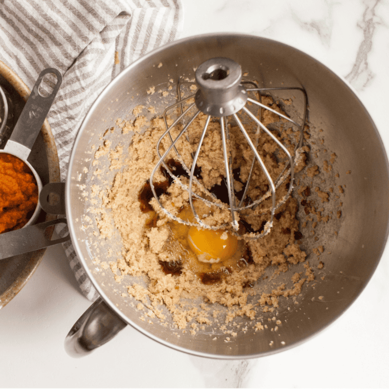 Creaming butter, granulated sugar and brown sugar in a mixing bowl until light and fluffy