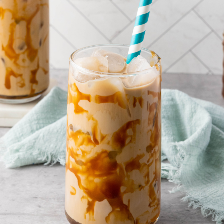 Salted caramel mocha iced coffee topped with whipped cream, caramel, and flaky sea salt