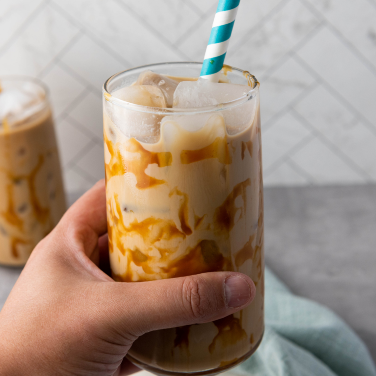 Buc-ee's iced coffee recipe served in a tall glass with a straw and caramel drizzle
