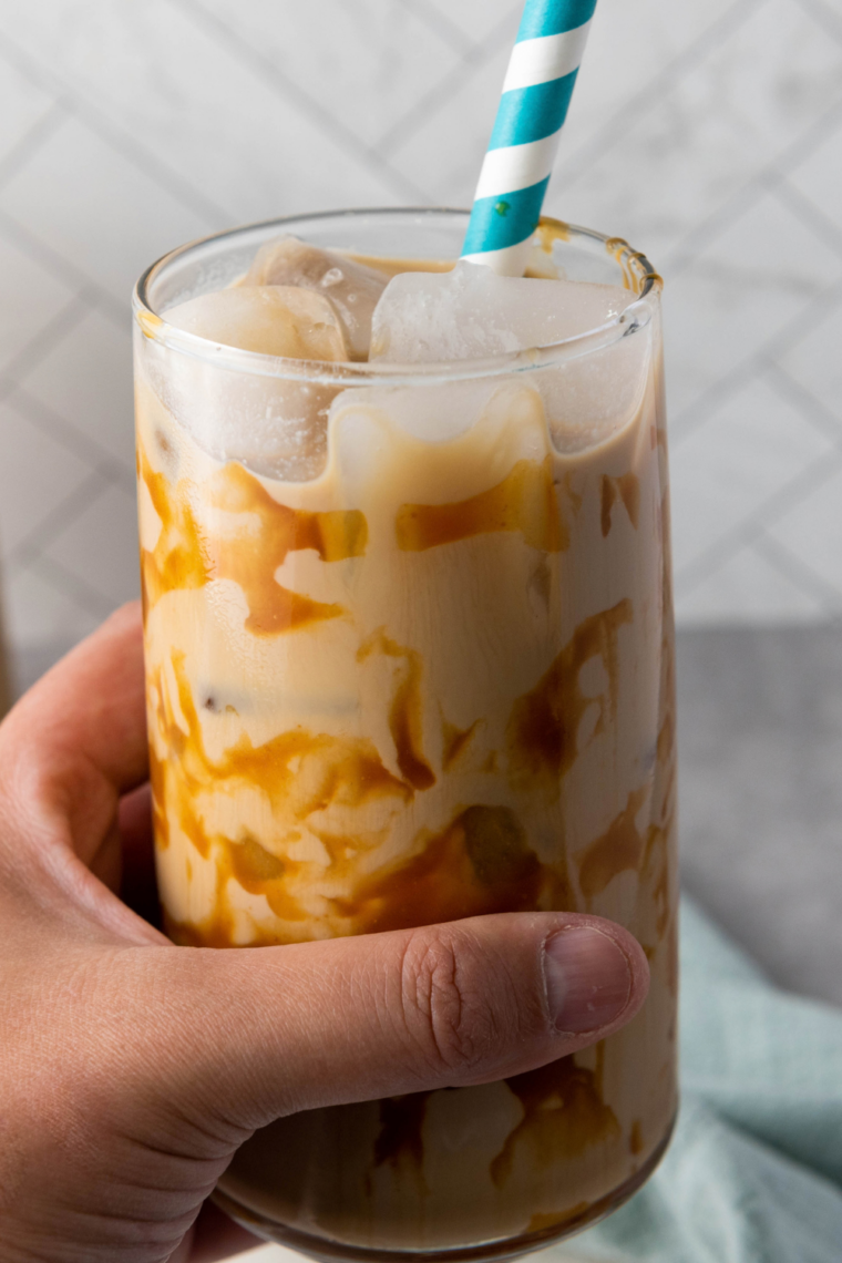 Caramel macchiato style iced coffee topped with a crosshatch caramel drizzle