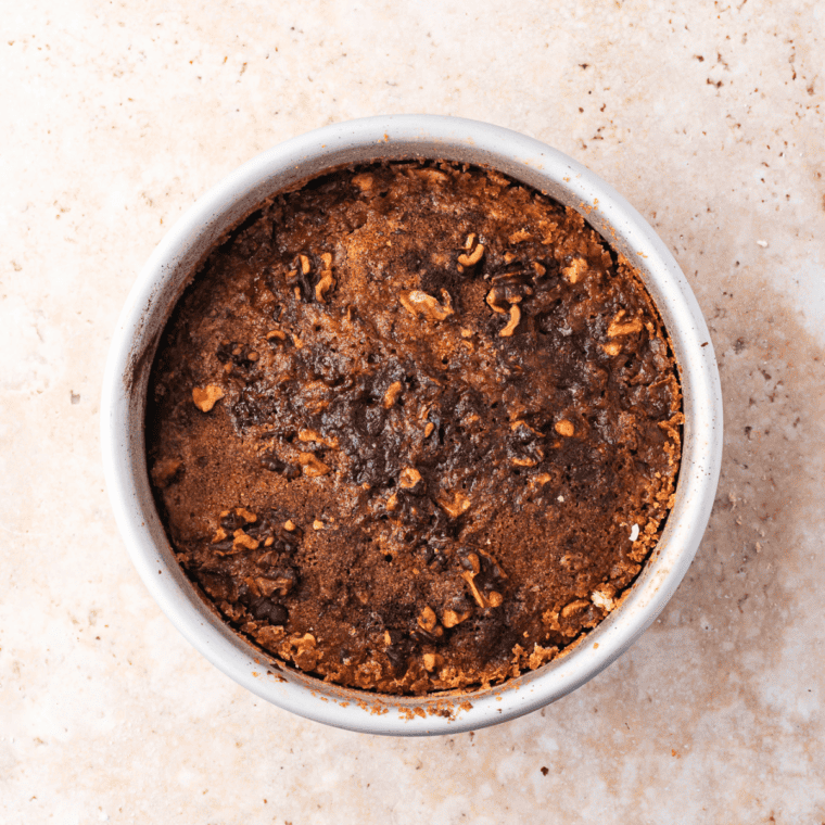 Golden brown air fryer banana bread dump cake fresh from the air fryer with toothpick test