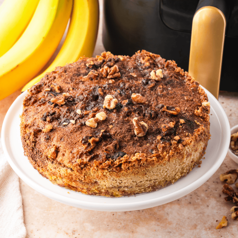 Close-up of gooey banana layer and crisp cake mix topping in air fryer banana bread dump cake