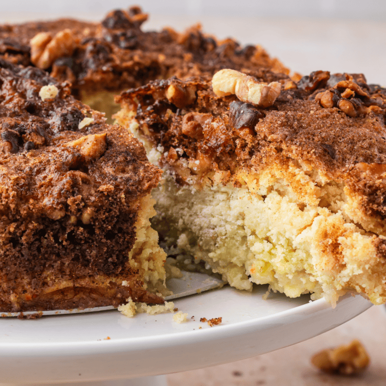 Air fryer banana bread dump cake topped with melted chocolate chips and chopped walnuts