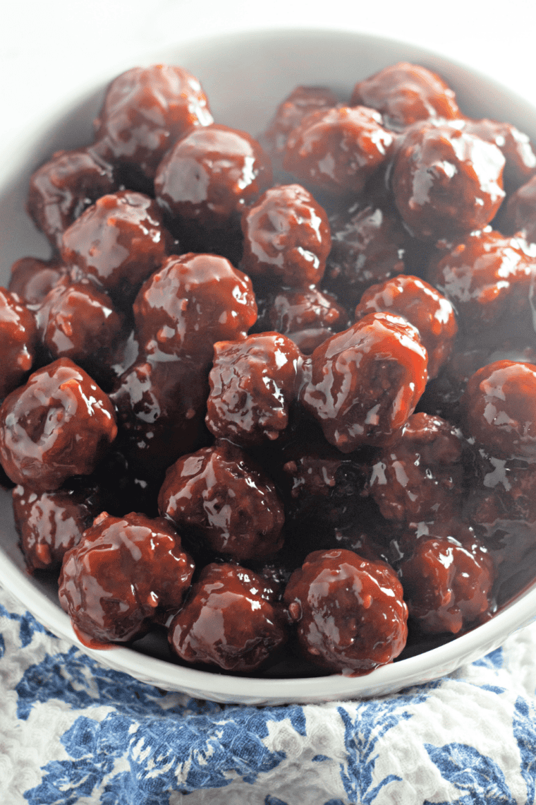 Cranberry chili sauce meatballs on a holiday appetizer platter with toothpicks