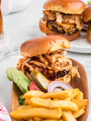 copycat Carl's Jr. Western Bacon Cheeseburger with crispy onion rings, bacon, and BBQ sauce on a toasted seeded bun