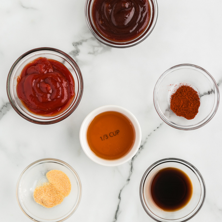 Ingredients for copycat Hardee&rsquo;s BBQ sauce including ketchup, brown sugar, molasses, vinegar, and spices