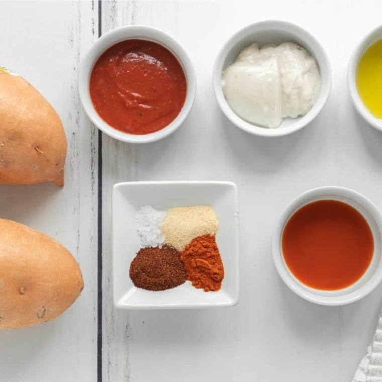 Ingredients for copycat Santa Fe sauce including mayonnaise, smoked paprika, cumin, chili powder, and onion powder