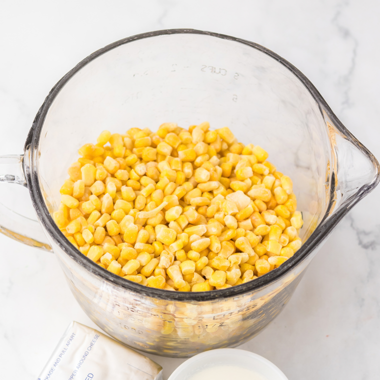 Ingredients for Lawry's creamed corn: frozen sweet corn, heavy cream, milk, butter, sugar, salt, white pepper, and flour.